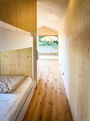 Ein Bett oder Betten in einem Zimmer der Unterkunft Die Klingerei - Tiny House Wiese - Your Austrian Home