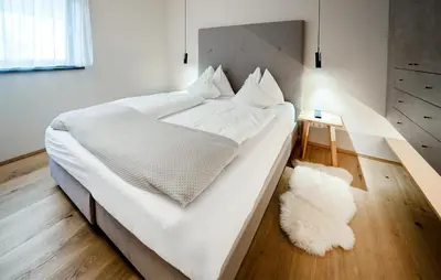 Ein Bett oder Betten in einem Zimmer der Unterkunft Ferienhaus Mit Sauna