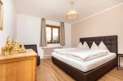 Ein Bett oder Betten in einem Zimmer der Unterkunft Herzerl-Chalet Appartements