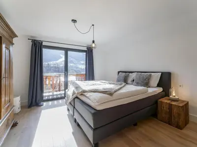 Ein Bett oder Betten in einem Zimmer der Unterkunft Mozart Lodge