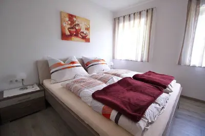 Ein Bett oder Betten in einem Zimmer der Unterkunft Apartments Winkler