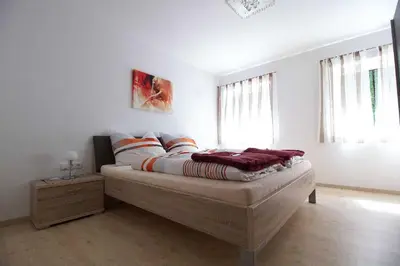 Ein Bett oder Betten in einem Zimmer der Unterkunft Apartments Winkler