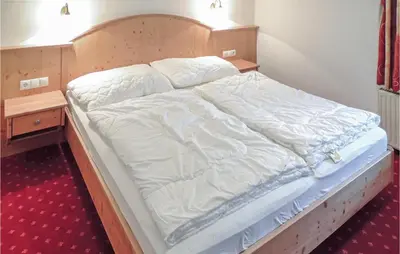Ein Bett oder Betten in einem Zimmer der Unterkunft Schoene Ferienwohnung Flachau
