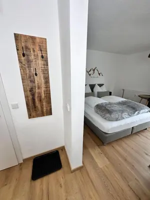 Ein Bett oder Betten in einem Zimmer der Unterkunft Grimming Lodge Tauplitz