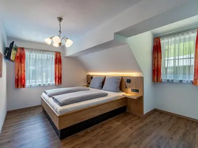 Ein Bett oder Betten in einem Zimmer der Unterkunft Apartment Karlspitz by Interhome