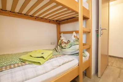 Ein Bett oder Betten in einem Zimmer der Unterkunft Ferienwohnung Nagelschmied