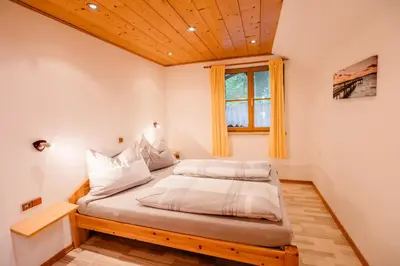 Ein Bett oder Betten in einem Zimmer der Unterkunft Ferienwohnung Kogler