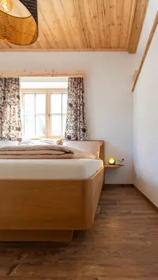 Ein Bett oder Betten in einem Zimmer der Unterkunft Beim Schwarzmarl - Your Austrian Home