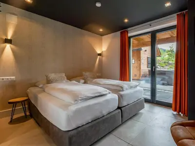Ein Bett oder Betten in einem Zimmer der Unterkunft Alpinn Wellness 1