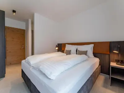 Ein Bett oder Betten in einem Zimmer der Unterkunft Grebenzen Lodge 55