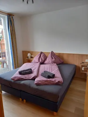 Ein Bett oder Betten in einem Zimmer der Unterkunft Haus Aineckblick, Liftstrasse 250, Top 3