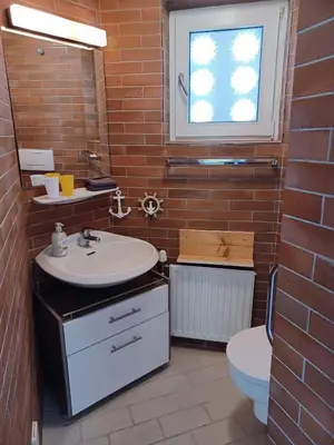 Ein Badezimmer in der Unterkunft Villa Romy - Ferienwohnung