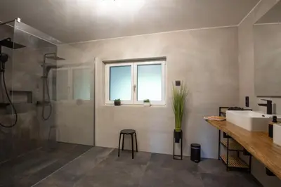 Ein Badezimmer in der Unterkunft Jubiläum Apartment
