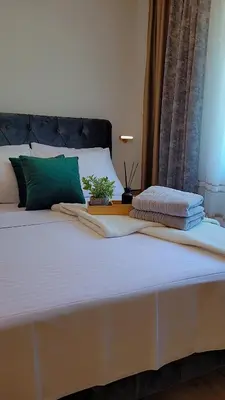 Ein Bett oder Betten in einem Zimmer der Unterkunft Noor Lux Apartments