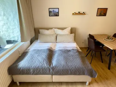 Ein Bett oder Betten in einem Zimmer der Unterkunft Bergruhe