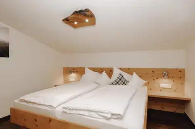 Ein Bett oder Betten in einem Zimmer der Unterkunft Hubertus - Das Landhaus