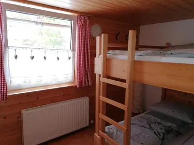 Ein Bett oder Betten in einem Zimmer der Unterkunft Stoderhütte