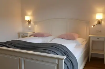 Ein Bett oder Betten in einem Zimmer der Unterkunft Pension Geissler-Reicher