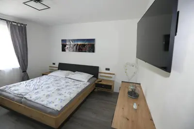 Ein Bett oder Betten in einem Zimmer der Unterkunft Ferienwohnung Sölkner