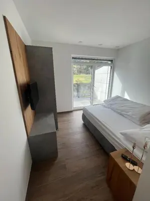 Ein Bett oder Betten in einem Zimmer der Unterkunft Penthouse Lorenzerhof