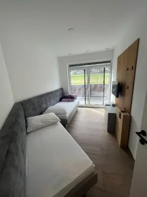 Ein Bett oder Betten in einem Zimmer der Unterkunft Penthouse Lorenzerhof