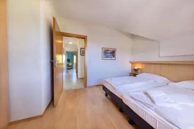Ein Bett oder Betten in einem Zimmer der Unterkunft Residenz Monica Top 10