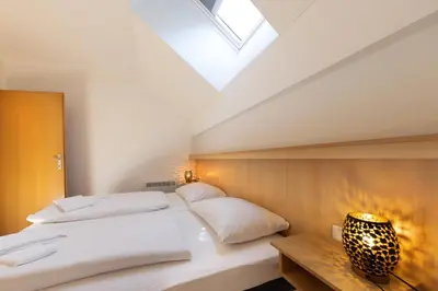 Ein Bett oder Betten in einem Zimmer der Unterkunft Residenz Monica Top 10
