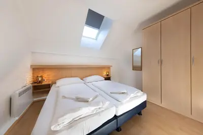 Ein Bett oder Betten in einem Zimmer der Unterkunft Residenz Monica Top 10