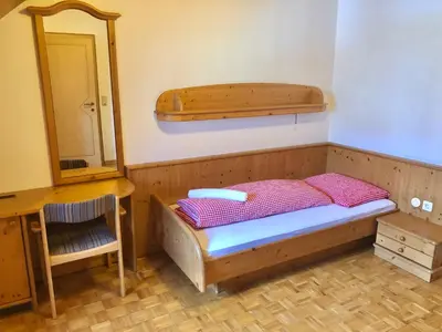 Ein Bett oder Betten in einem Zimmer der Unterkunft Hotel Ledererwirt