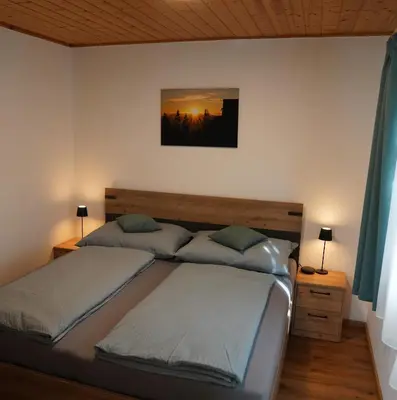 Ein Bett oder Betten in einem Zimmer der Unterkunft Ferienhaus Romantika