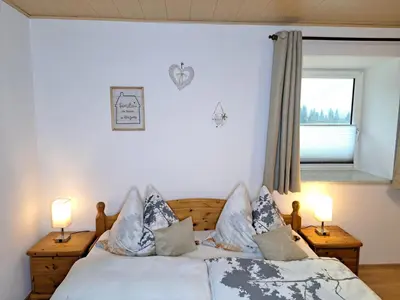 Ein Bett oder Betten in einem Zimmer der Unterkunft Peterhof – komm als Gast & geh als Freund