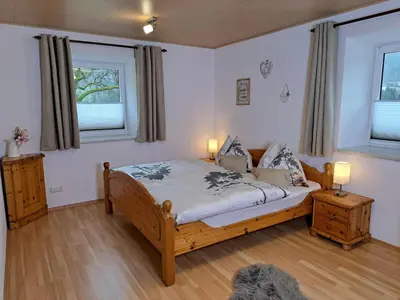 Ein Bett oder Betten in einem Zimmer der Unterkunft Peterhof – komm als Gast & geh als Freund