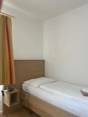 Ein Bett oder Betten in einem Zimmer der Unterkunft OptimaMed Gesundheitsresort Bad Wimsbach