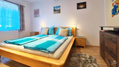 Ein Bett oder Betten in einem Zimmer der Unterkunft Familienappartement Seppenbauer