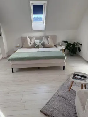 Ein Bett oder Betten in einem Zimmer der Unterkunft Alpenliebe