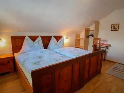 Ein Bett oder Betten in einem Zimmer der Unterkunft Ferienhaus Dachsteinheim