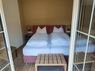 Ein Bett oder Betten in einem Zimmer der Unterkunft Hotel-Bad Goisern