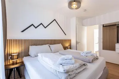 Ein Bett oder Betten in einem Zimmer der Unterkunft Alpine Suite Spot