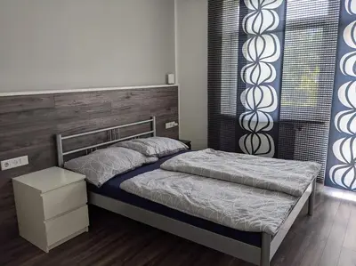 Ein Bett oder Betten in einem Zimmer der Unterkunft Schöne Wohnung mit Terrasse, Garten und-Pool