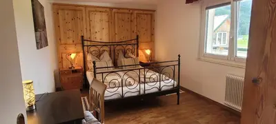 Ein Bett oder Betten in einem Zimmer der Unterkunft Apartmenthaus Edelweiss in Gosau