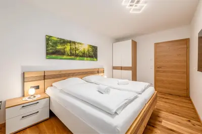 Ein Bett oder Betten in einem Zimmer der Unterkunft GardenAlpin & PanoramaAlpin Apartments - by myNests