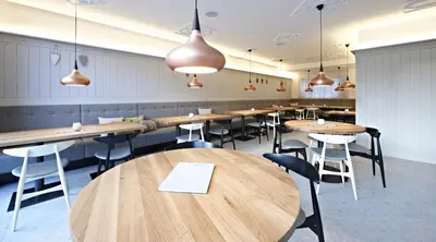 Ein Restaurant oder anderes Speiselokal in der Unterkunft Badhaus - Hotel/Restaurant/Café