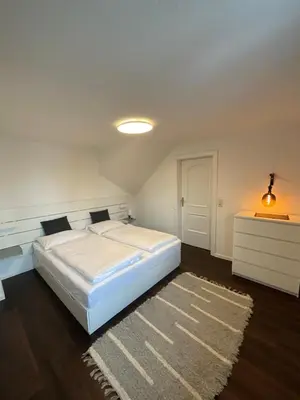 Ein Bett oder Betten in einem Zimmer der Unterkunft Die Bergretter Appartements