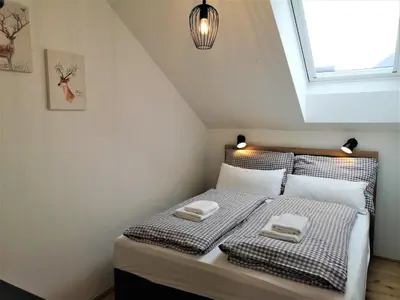 Ein Bett oder Betten in einem Zimmer der Unterkunft Tauplitz Panorama Apartment, 75qm, Balkon und Sauna