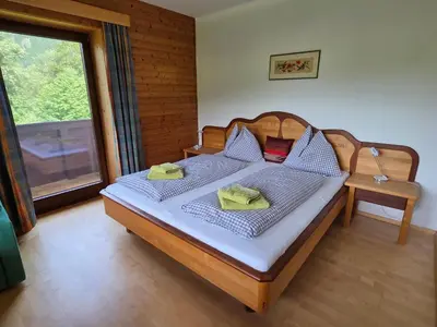Ein Bett oder Betten in einem Zimmer der Unterkunft Ferienhaus Almfrieden