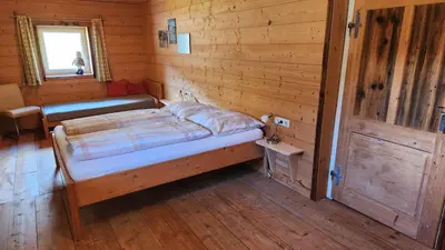 Ein Bett oder Betten in einem Zimmer der Unterkunft Ferienhaus Eckstoa