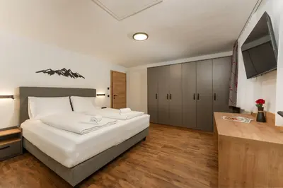 Ein Bett oder Betten in einem Zimmer der Unterkunft Das Ennshaus by Schladming-Appartements