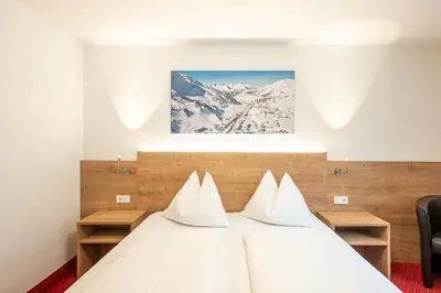 Ein Bett oder Betten in einem Zimmer der Unterkunft Hotel Appartement Winter
