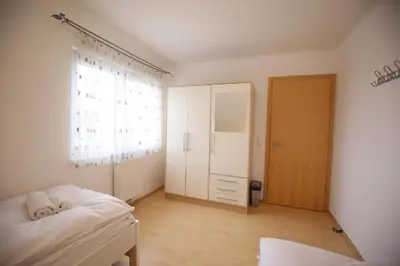 Ein Bett oder Betten in einem Zimmer der Unterkunft Ferienhaus Aich by Alpenidyll Apartments