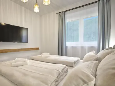 Ein Bett oder Betten in einem Zimmer der Unterkunft Gipfelblick Lodge 5 Pruggern by AA Holiday Homes